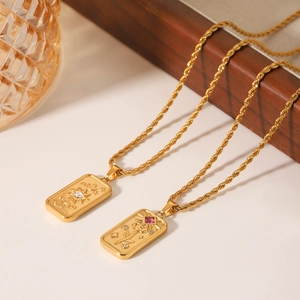 Gold tarot pendants with rose and sun moon relief on twisted chain necklaces