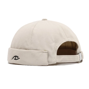 Beige cotton docker hat with abstract embroidery and adjustable back strap