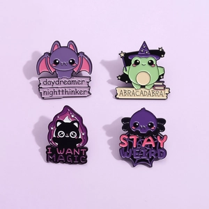 Set of four cartoon magic animal enamel pins with creative English quotes on purple background
