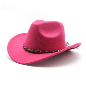 Detail of fuchsia wool cowboy hat crown with braided band and ethnic metallic beads