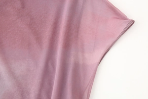 Detail of pink mesh fabric with professional overlock stitching on the edge of the dress