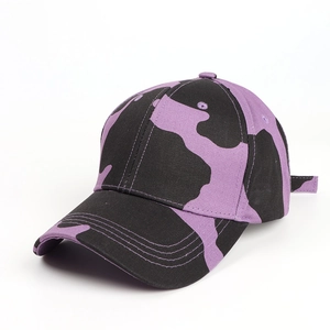 Detail of purple and black cow print cotton baseball cap with adjustable metal buckle