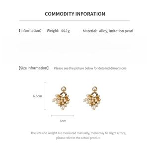 Detailed view of vintage gold knot earrings with pearl tassels and size dimensions