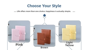 Detailed view of leather loose-leaf notebooks in pink, brown and pale yellow with buckles
