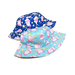 Kids reversible bucket hat featuring cute cartoon elephant and floral patterns in blue