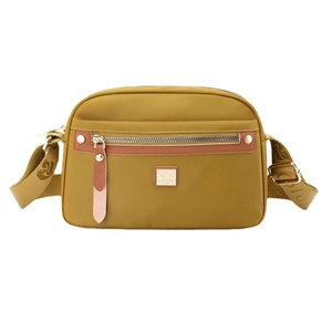 Waterproof ginger yellow nylon crossbody bag with brown leather accents and wide strap