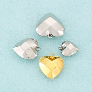 Polished heart-shaped stainless steel faceted pendants in gold and silver finishes