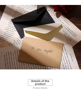 Close-up of vintage mini kraft paper envelopes with handwritten To Mr. Right on book