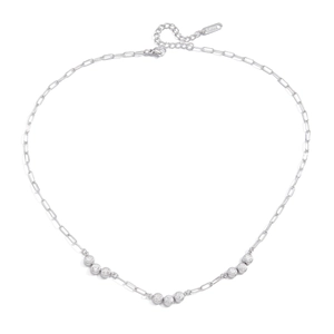 Detail of silver paperclip chain necklace with round white cubic zirconia charms