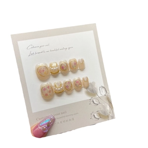 Baroque style handmade press-on nails with pearls and dried flowers in pink