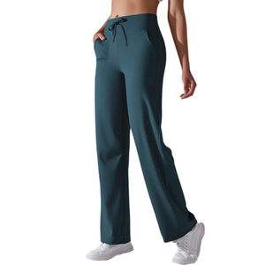High-waisted wide leg yoga pants in deep teal with drawstring waist and functional pockets