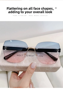 Detail view of rimless gradient sunglasses with titanium temples on marble case