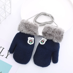 Detail of blue knitted toddler mittens with gray faux fur cuffs and anti-lost neck string