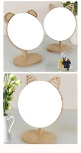 Detail of wooden desktop makeup mirrors with cute animal ears and sturdy oval base