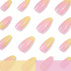 Glossy long almond press-on nails with pink and yellow dreamlike gradient design