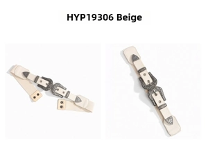 Detail view of beige elastic waist belt with dual vintage carved buckles and leather finish