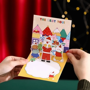 3D Pop-up Christmas card featuring Santa and Gingerbread man with festive gold foil detailing