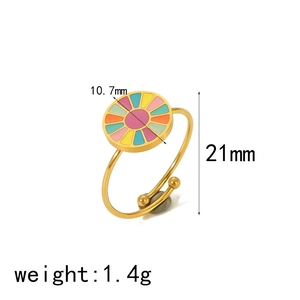 Detail view of adjustable gold stainless steel ring with colorful enamel flower motif