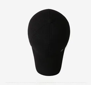 Top view of a high-quality black winter baseball cap with classic six-panel construction