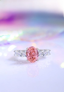 Macro shot of oval pink gemstone ring in S925 sterling silver with four-prong setting