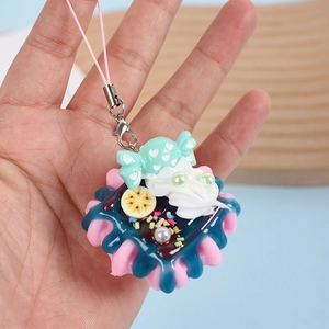 Mini strawberry cream cake keychain with colorful toppings and pink lanyard for bag decor