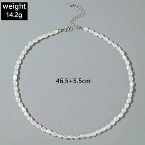 Detail of elegant pearl necklace with lobster clasp and adjustable extension chain link