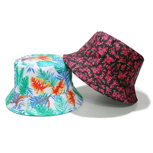 Women's floral and tropical leaf print cotton sun protection bucket hats on white background