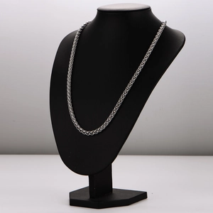 Silver stainless steel keel chain necklace for men displayed on a black neck bust