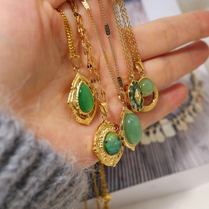 Detailed close-up of 18K gold plated necklaces featuring green natural stone pendants