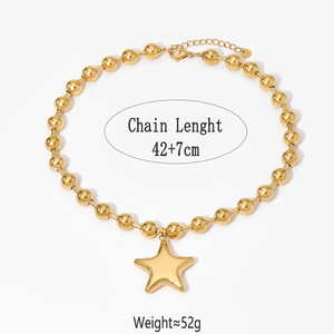 Detail view of gold beaded chain necklace with large 3D star pendant, 42+7cm length