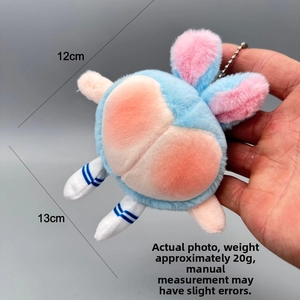 Detail showing the 12cm height and 13cm width of the pink and blue plush bear keychain