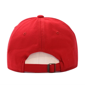 Red cotton baseball cap with distressed hole and adjustable bronze metal buckle back