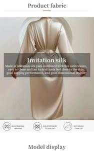 Detail of champagne silk robe texture showing premium satin weave and soft fabric drape