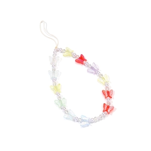 Detail of handmade colorful acrylic butterfly and pearl beads on a wrist phone strap