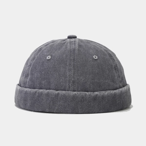 Macro shot of vintage dark grey washed cotton fabric on the six-panel docker cap