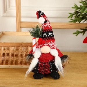 Christmas gnome plush with red plaid skirt, knitted hat, holding a festive candy cane