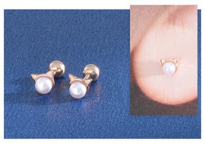 Close-up of cat-shaped rose gold pearl earrings with secure screw-on ball backings
