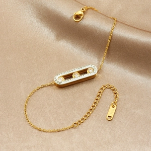 Minimalist gold-plated stainless steel chain bracelet with a sliding diamond bar pendant
