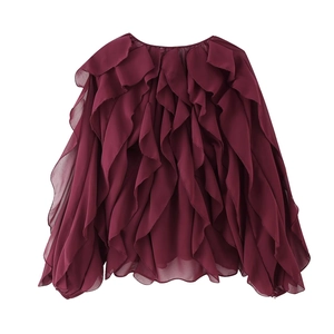 Detail of wine red layered ruffle chiffon shirt with V-neck and lightweight fabric texture