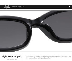 Detailed close-up of the lightweight black nose bridge support on these oval sunglasses