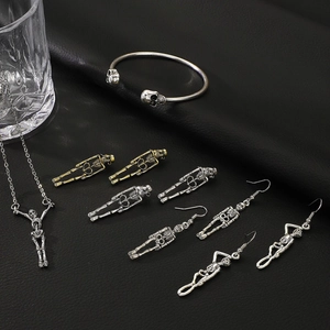 Gothic punk skull jewelry set including skeleton necklace, bracelet and earrings