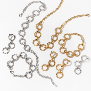 Fashionable stainless steel jewelry set featuring circular link necklace, bracelet and earrings