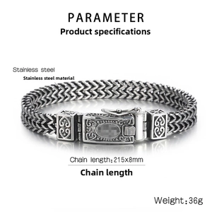Detail of vintage stainless steel double-row braided bracelet with heart motif clasp