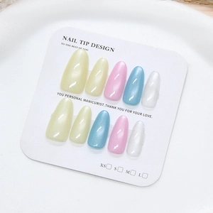 Long almond cat eye press-on nails set in colorful macabre pastel pearl finishes