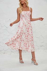Detailed view of white floral summer dress with drawstring chest and pink flower pattern