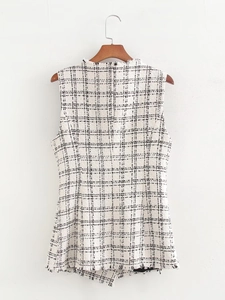 Detail view of the back of a beige tweed sleeveless vest with fringe and black check pattern