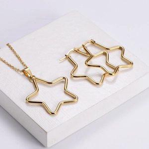 Polished stainless steel star pendant necklace and earring set in radiant gold finish