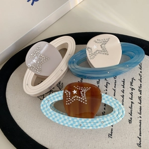 Three-piece planet hair clips with zircon star patterns in amber, cream, and lavender