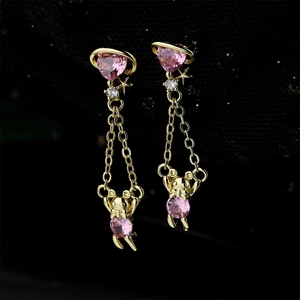 Gold-plated bear earrings with pink heart stones and long tassels on black lace