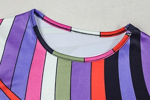 Detail shot of the reinforced crew neck stitching on this colorful striped dress